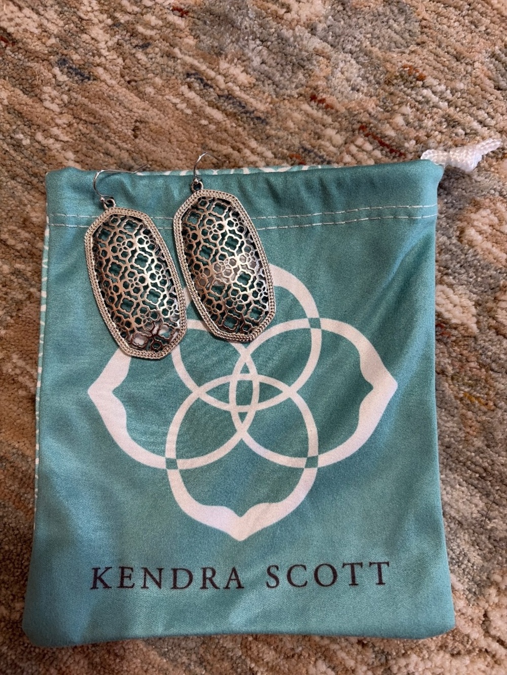 Kendra Scott earrings.